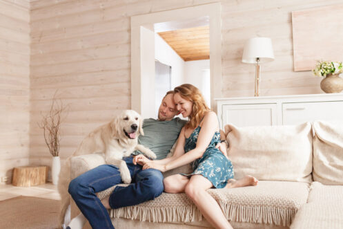Young couple with their dog in their Anoka, MN home