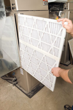 Changing the furnace filter with a pleated filter