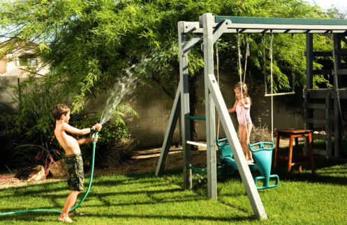 Two children playing in their backyard in Anoka, MN